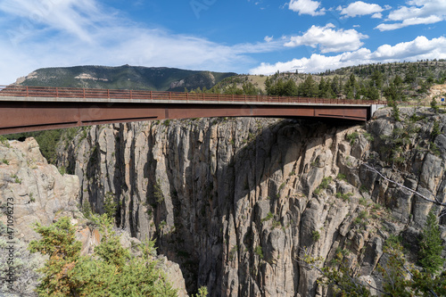 The Sunlight Bridge crosses the Sunlight Gorge and Sunlight Creek on the Chief Joseph Highway just outside the Beartooth Mountains and Yellowstone National Park in Wyoming on a sunny summer afternoon