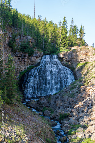 A view of Rustic Falls in the Golden Gate Canyon in Yellowstone National Park in Wyoming near Gardiner, Montana on a sunny summer day 
