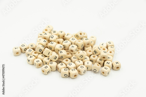 beads with english letters in a heap on a white background