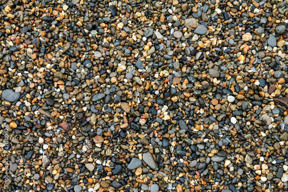 Background texture wet sea pebbles, top view Background texture wet sea pebbles, top view