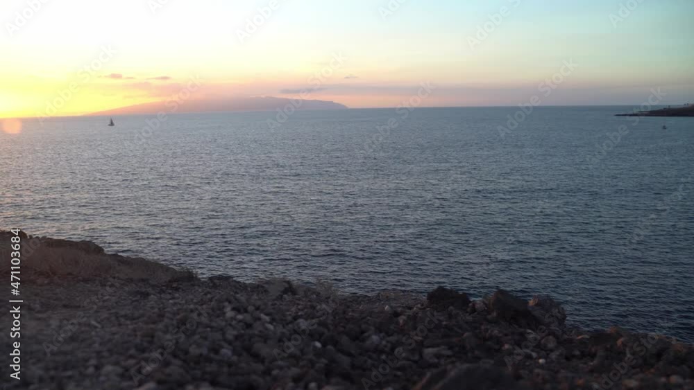 Sunset in La Caleta, Costa Adeje, Tenerife. Panorama view from park La cueva over the sea panning to the rocks Sunset in La Caleta, Costa Adeje, Tenerife. Panorama view from park La cueva over the sea panning to the rocks