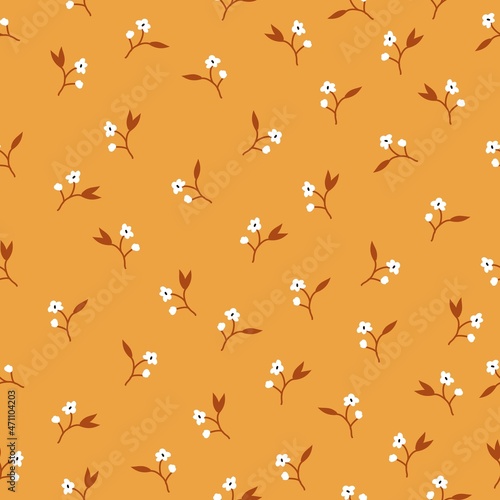 Seamless vintage pattern.  Small white flowers. orange background. vector texture. Fashionable print for textiles and wallpaper. © Алена Шенбель