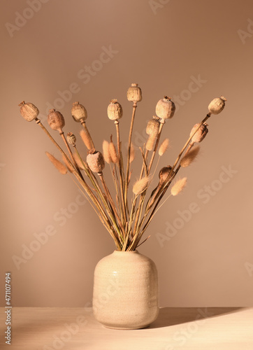 Vase with dried plants