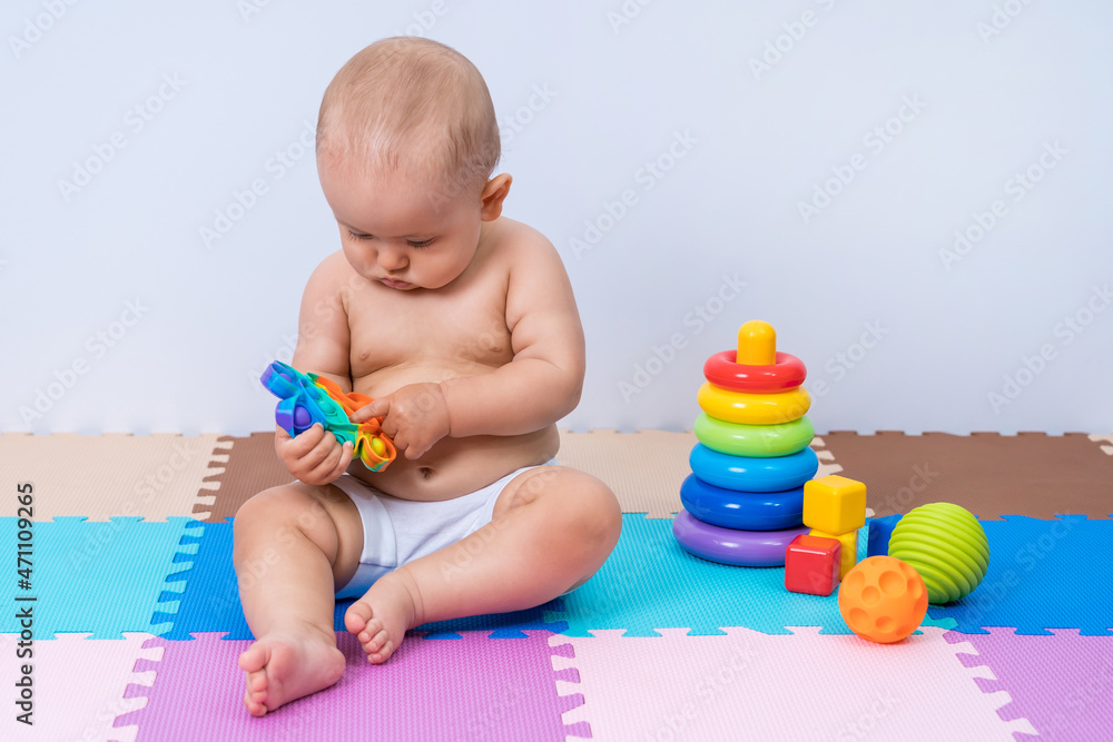 Toddler child playing with modern toy pop it Toddler child playing with modern toy pop it