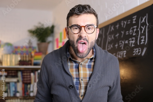 Quadro em tela Angry teacher sticking tongue out