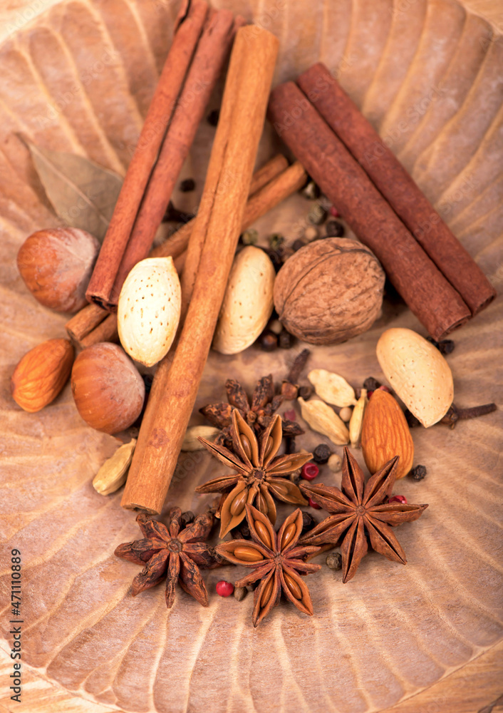 Traditional Christmas spices - Star anise with cinnamon and cloves on dark rustic wooden background