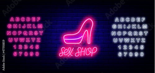 Sex shop neon emblem on brick wall background. High heeled shoe. White and pink alphabet. Isolated vector illustration