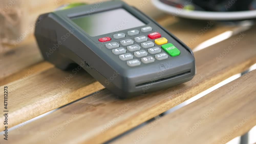 NFC credit card payment. Woman paying with contactless credit card with NFC technology. Wireless money transaction. Wireless payment NFC credit card payment. Woman paying with contactless credit card with NFC technology. Wireless money transaction. Wireless payment