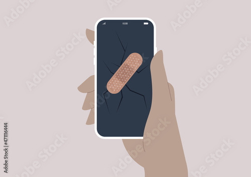 Repair service, an adhesive band aid tape on a broken mobile phone screen