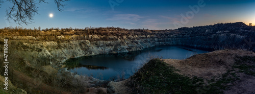 Fototapeta Naklejka Na Ścianę i Meble -  Flooded granite quarry at night. Panorama. Industrial landscape. Kryvyi Rih, Ukraine.