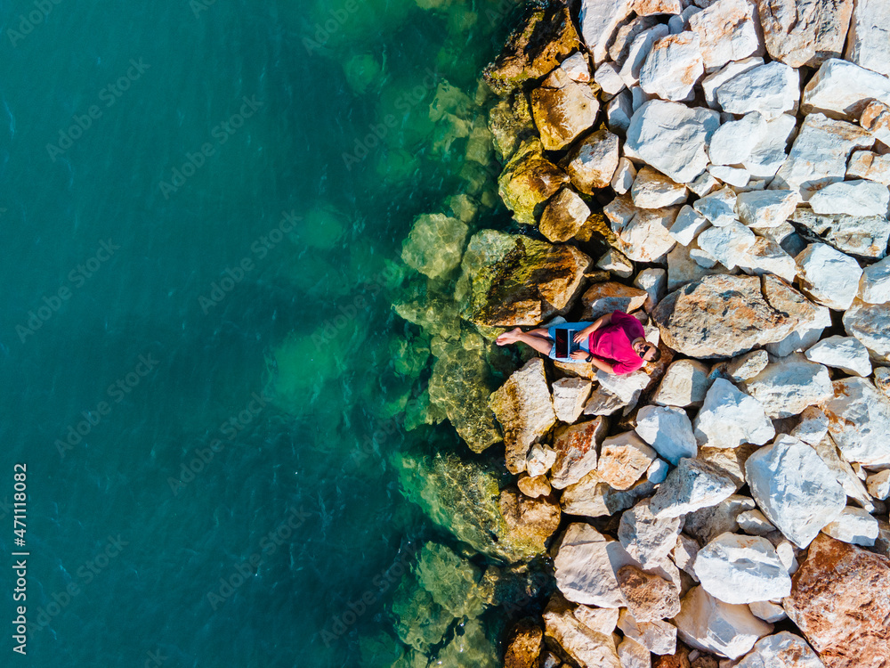 Fototapeta premium overhead view man with laptop working on laptop