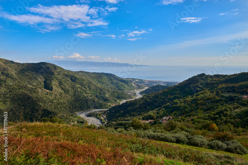 the Savoca stream runs through the valley and flows into the Ionian sea of the Strait of Messina on a beautiful sunny day in Autumn