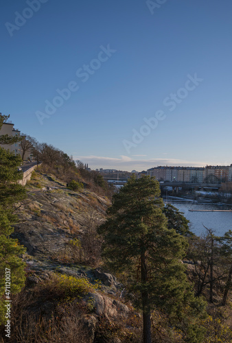 Cliff water front view in the district Marieberg a sunny color full autumn day in Stockholm photo
