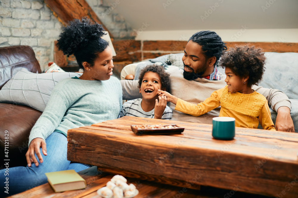 Happy black family has fun while spending time together at home. - obrazy, fototapety, plakaty 