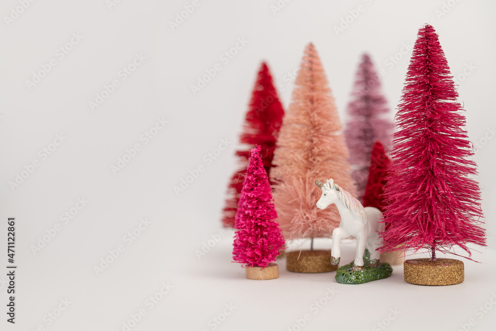 Miniature Unicorn in Pink, Purple, and Red Bottle Brush Trees
