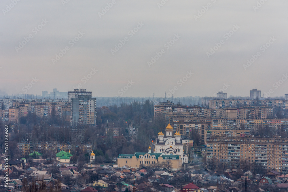 City in the evening. Top view of the Orthodox church. Urban landscape. Kryvyi Rih, Ukraine.