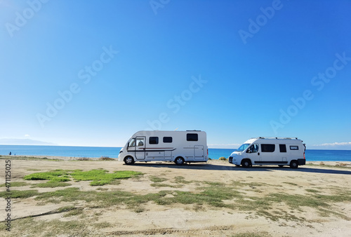 caravans cars beside sea beach in autumn greece