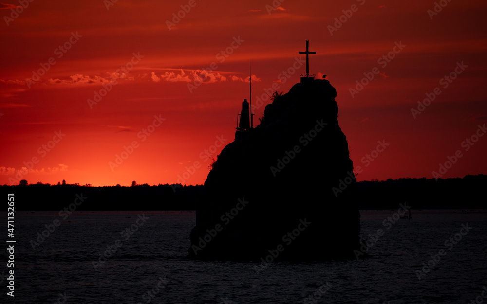 Beautiful colorful sunrise at the sea with dramatic clouds and sun shining at Moldova Noua on the Danube gorge Beautiful colorful sunrise at the sea with dramatic clouds and sun shining at Moldova Noua on the Danube gorge