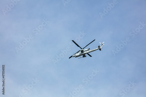 An Apache Helicopter Flying Overhead in a Blue Sky on a Training Mission in California