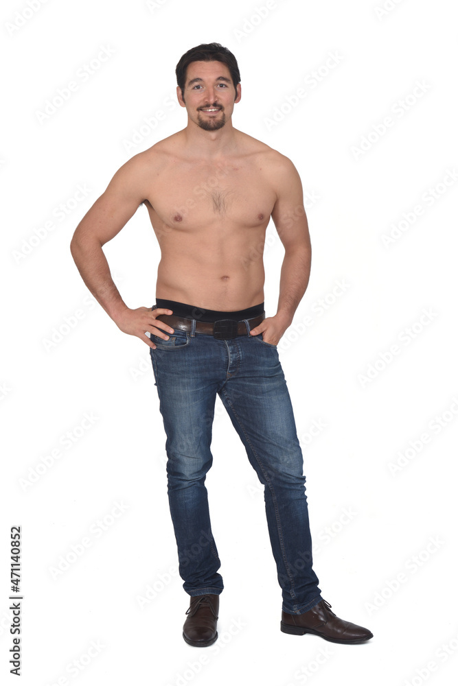 man shirtless and with blue jeans looking at camera on white background man shirtless and with blue jeans looking at camera on white background