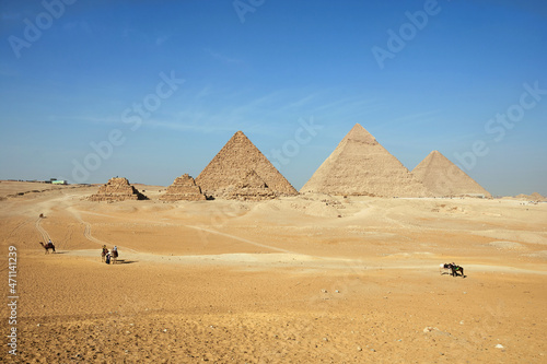 The Giza pyramid complex or Giza Necropolis in Egypt including the Great  Cheops  Pyramid  the Pyramid of Khafre  and the Pyramid of Menkaure  and pyramids of Queens