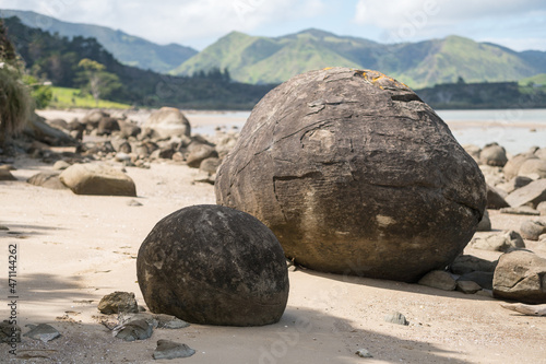 Koutu Boulders beach with perfect ball shape in New Zealand photo