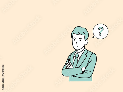 考え込む　考える　会社員　ビジネスマン　スーツ姿の男性　思考　疑問　腕を組む　？