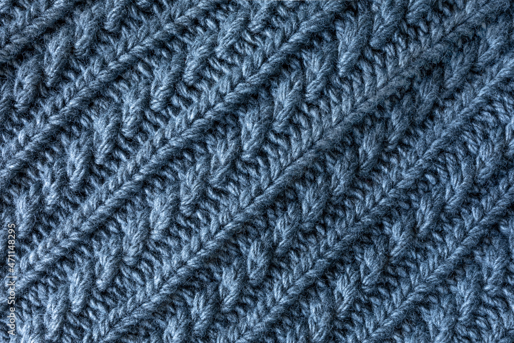 sample of grey wool knitting. background of gray wool fabric. diagonal arrangement sample of grey wool knitting. background of gray wool fabric. diagonal arrangement