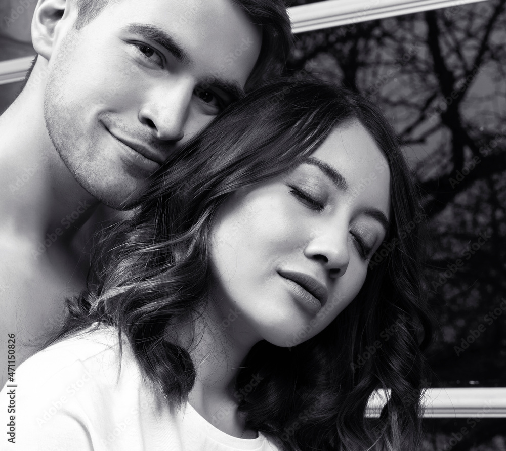Fototapeta premium young pretty couple together in bed sleeping chill, lifestyle people concept, black and white
