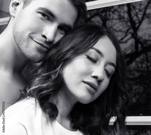 young pretty couple together in bed sleeping chill, lifestyle people concept, black and white