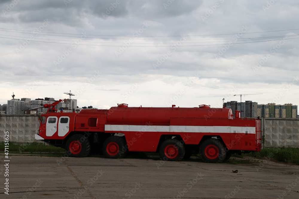 old red fire truck at the airfield