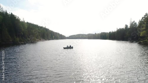 50fps aerial footage couple Kayaking Boat tour on lake Ragnerudssjoen in Dalsland Sweden beutiful nature forest pinetree photo