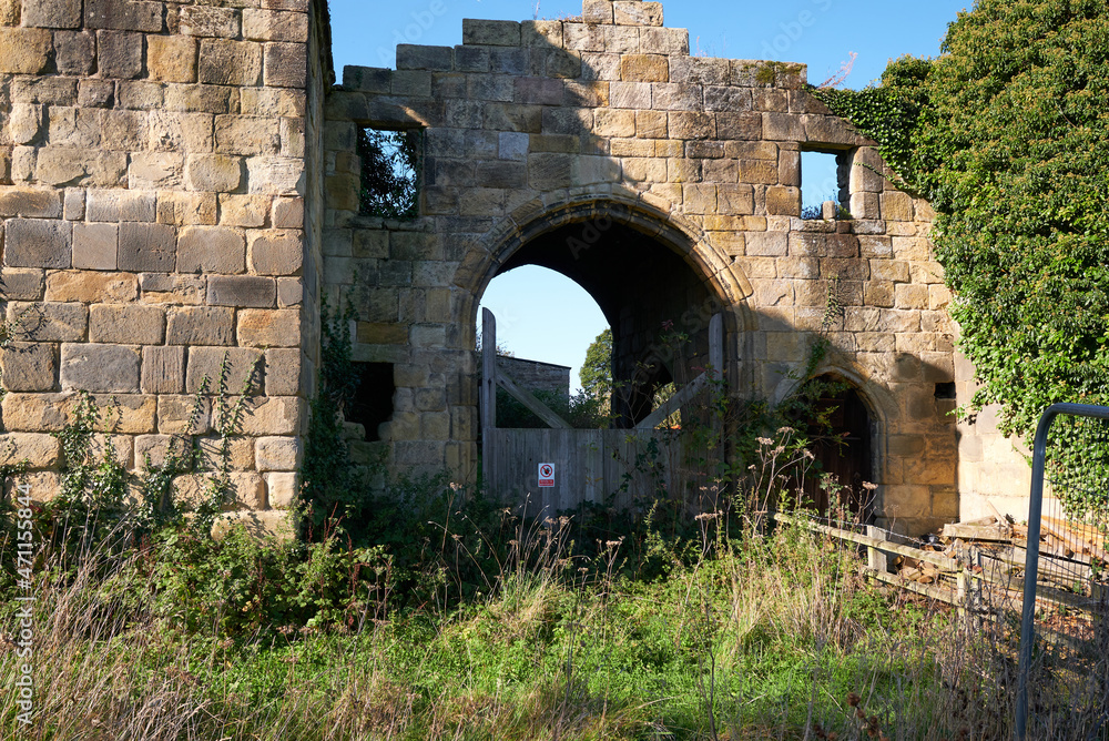 Main entrance to a ruined old manor house in South Wingfield, Derbyshire, UK
