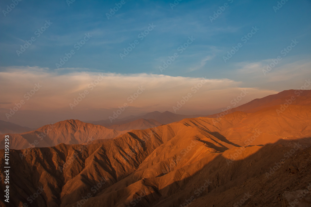 mountainous landscape, view from the top of a mountain, blue sky.