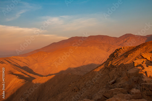 mountainous landscape, view from the top of a mountain, blue sky. © JuanSt