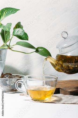 green tea and teapot on a light background