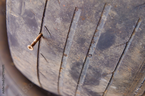 nail puncturing tire.nut on tire.accident tire.tire not userd.danger tire photo