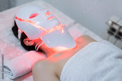 LED mask regenerative treatment applied to a young woman