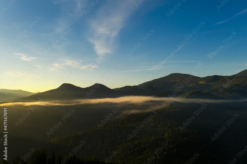 Beautiful view of forest in misty mountains on sunny day. Drone photography Beautiful view of forest in misty mountains on sunny day. Drone photography