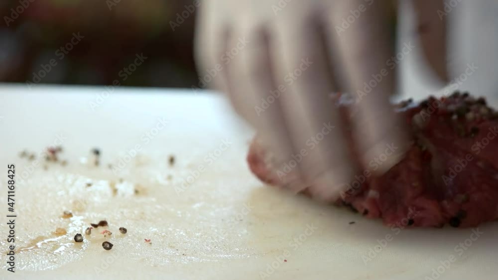 raw meat with spices closeup salt and black pepper raw meat with spices closeup salt and black pepper