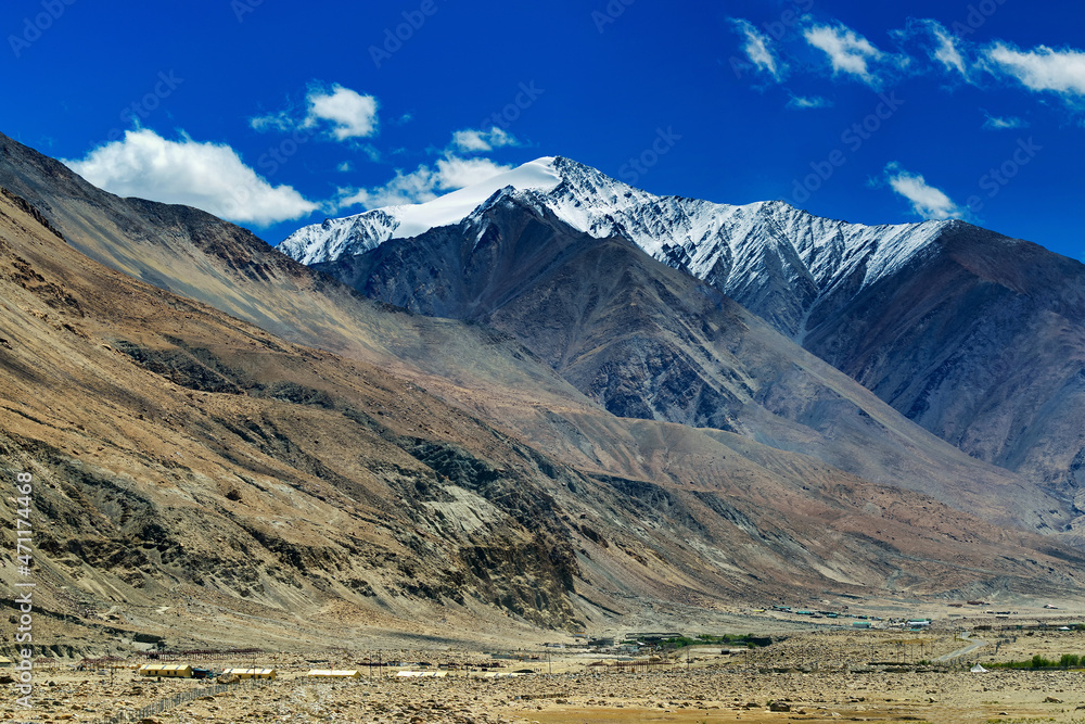 Scenic view of snow peaks, Leh ladakh landscape, light and shadow, Jammu and Kashmir, India Scenic view of snow peaks, Leh ladakh landscape, light and shadow, Jammu and Kashmir, India