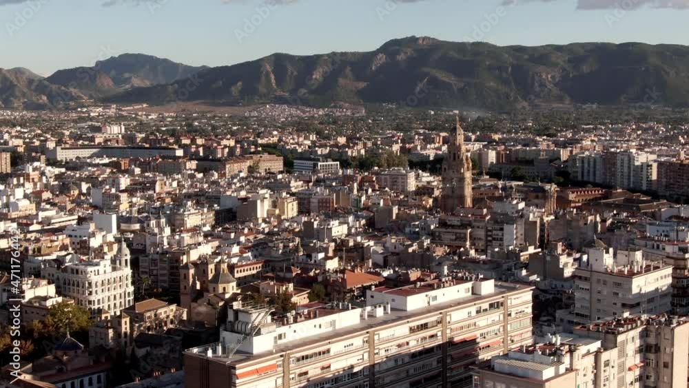 Aerial shot flying over Murcia city with a mountain backdrop in Spain Aerial shot flying over Murcia city with a mountain backdrop in Spain