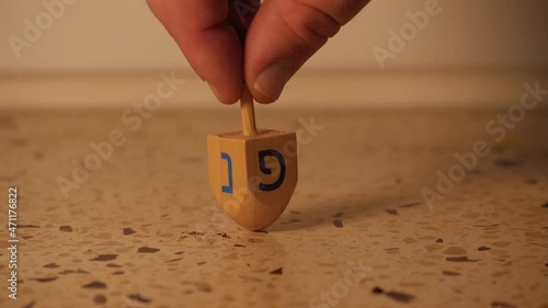 spinning dreidel Hanukkah slow motion 4k photo