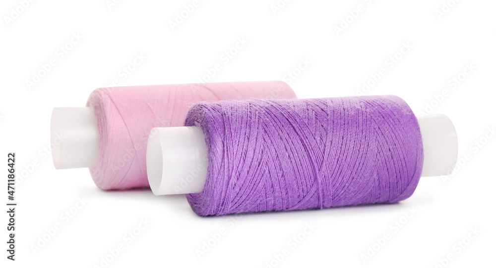 Different colorful sewing threads on white background Different colorful sewing threads on white background