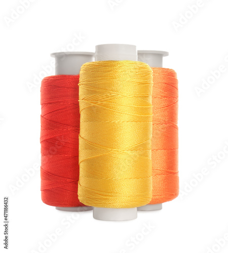 Different colorful sewing threads on white background