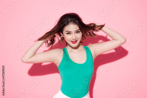 Beauty concept of a young asian woman. Hair care. Cosmetics.