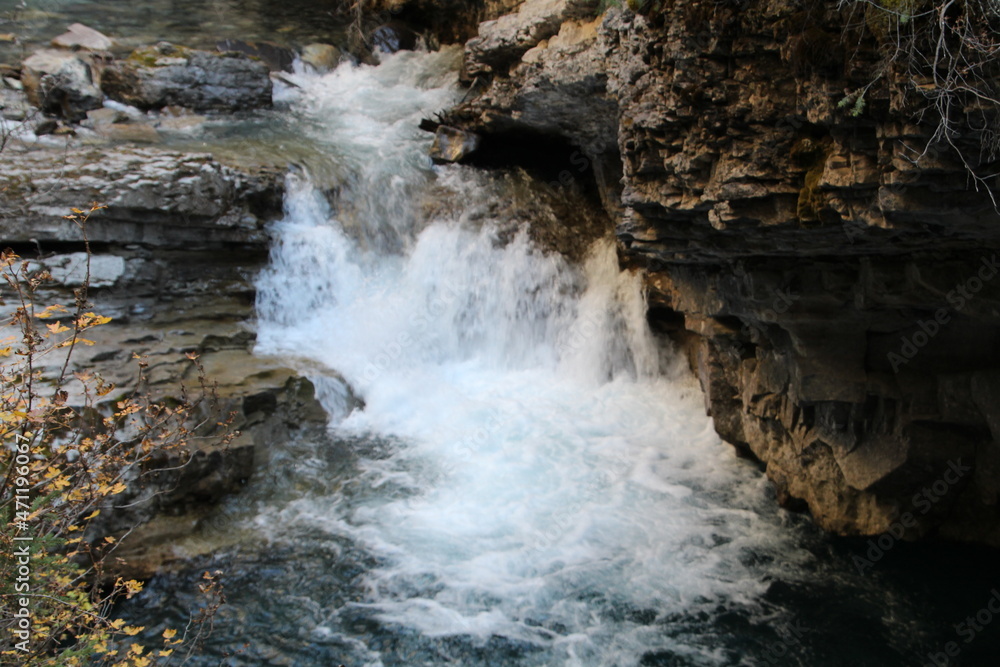 Naklejka premium waterfall in the forest, Banff National Park, Alberta