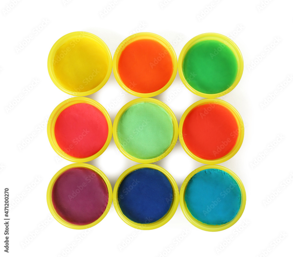 Plastic containers with colorful play dough on white background, top view Plastic containers with colorful play dough on white background, top view