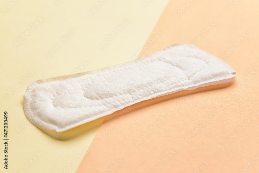 Menstrual pad on yellow background Menstrual pad on yellow background