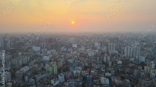 Wallpaper Mural Aerial top view of populated city at sunrise with dense buildings - establishing drone descending shot Torontodigital.ca